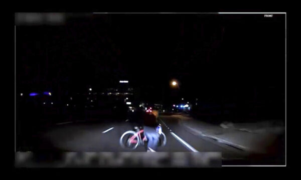 A screen grab from a video of a camera mounted in a self-driving Uber just before it hits a bicyclist.