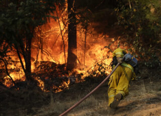 After the fires: A surprising story of a haunted hero and the ashes of regret