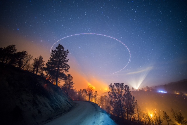 Image for In flames: journalism under fire, and the terrible beauty of wildfire photography