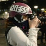 Eddy Binford-Ross takes a photo during protests in Portland, Oregon