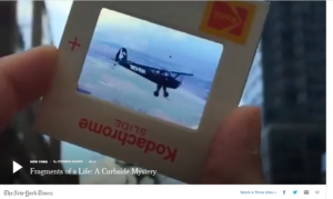 Deborah Acosta holds up a slide of a small plane as she tries to solve the mystery of the abandoned Kodachrome slides in "Fragments of a Life" for The New York Times.