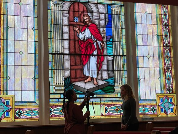 College students from Florida doing a broadcast report from inside the Sixteenth Street Baptist Church, where four Black girls were killed in a bombing on Sept. 15, 1963.