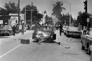 A trash receptacle set ablaze by demonstrators stops traffic on a street near the Miami Beach Convention Hall during the 1972 GOP convention. 