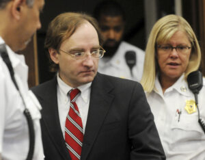 Christian Karl Gerhartsreiter, who called himself Clark Rockefeller, enters the courtroom for his kidnapping trial in in Boston. 