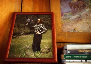 An 8x10 photograph of Mary English sits on the left side of the mantel above the fireplace in the cabin. Photo by Barbara Davidson / Los Angeles Times
