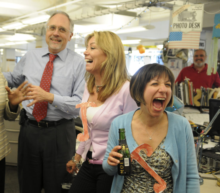 Philadelphia Daily News reporters Barbara Laker, center, and Wendy Ruderman, right, rejoice after winning the 2010 Pulitzer Prize for investigative reporting. 