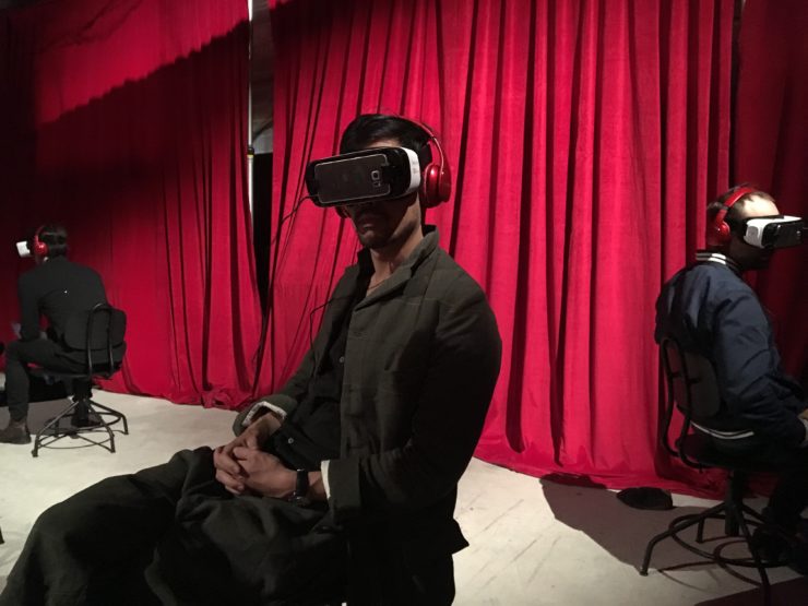 A festival-goer experiences virtual reality at the Future of Storytelling gathering.