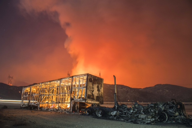 A smoldering moving van sits in the wake of the Blue Cut fire that burned across Interstate 15 north of San Bernardino, Calif.
8:59pm.  13 seconds with 24mm lens @f.5.6
