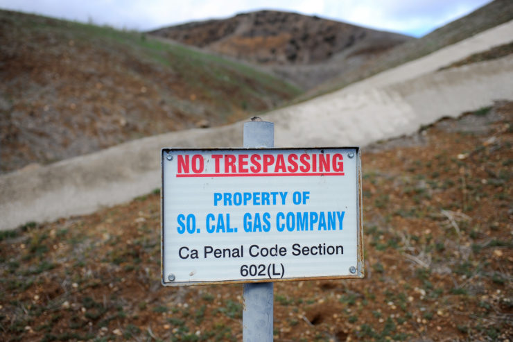 In this January 2016 photo, a sign declares the boundary line of the Southern California Gas Company gas fields where a gas well was leaking methane near the community of Porter Ranch, Calif. 