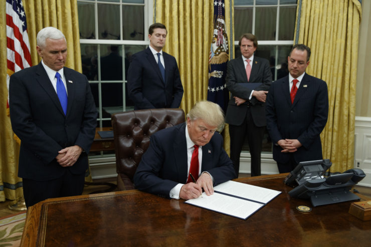 PresidentTrump signs his first executive order on healthcare in the Oval Office.
