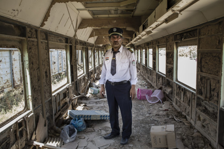 11/08/2016 -- Baghdad, Iraq -- 

A portrait of Ali Al-Karkhi inside one of the looted trains. Al-Karkhi explains that when he saw the trains being looted, he felt like bits of his body were being cut off.