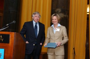 Columbia University President Lee C. Bollinger presents Dana Priest with the 2006 Pulitzer Prize in Beat Reporting.
