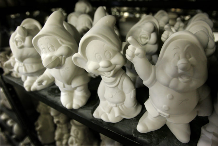 Ceramic castings of the Seven Dwarfs from Disney's Snow White sit on shelves at California Ceramic Supply in Euclid, Ohio.