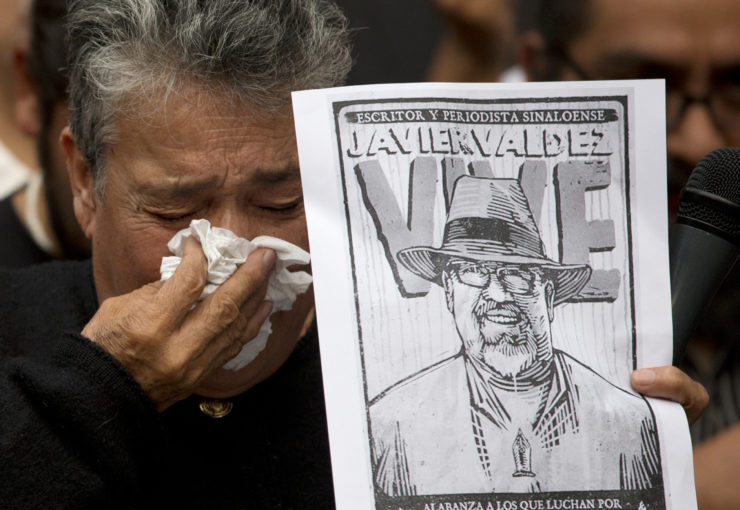 Maria Herrera, a mother who became active in the search for Mexico's missing after four of her sons disappeared, weeps after speaking about murdered journalist Javier Valdez during a protest a day after he was slain. 