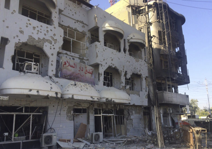 Buildings are damaged after clashes between Iraqi security forces and ISIS members in Kirkuk.