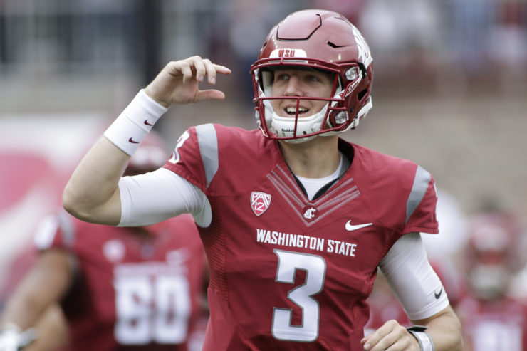 Washington State quarterback Tyler Hilinski takes the home field against Idaho in September 2016. He was considered a pro-level talent, but suffered from depression and CTE. He took his own life in January 2018