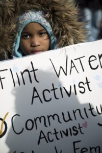 Seanna Dixon, 7, of Flint, Michigan, joins the Selma Solidarity March on Sunday, March 5, 2017, commemorating the 1965 march by African-Americas demanding the right to vote. In Flint, local residents also demanded the right to clean water.