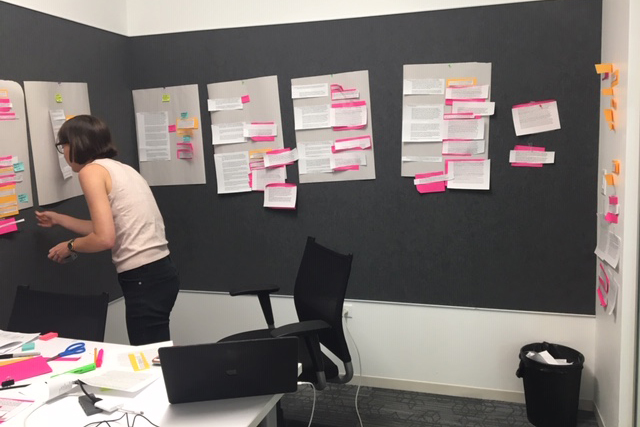 Reporter Logan Jaffe works the project's visual storyboard, a color-coded outline of the various elements: the family's journal entries, the reporters' contextual passages and the annotations adding explanation and clarity