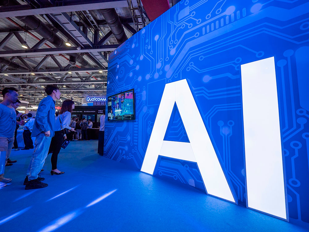 Artificial Intelligence (AI) signage is seen at the stand of electronics company Xiaomi during the 2018 China Mobile Global Partner Conference in Guangzhou, China in December 2018