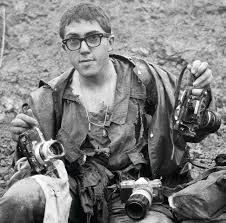 John Olson as a young photographer covering the Tet Offensive in 1968