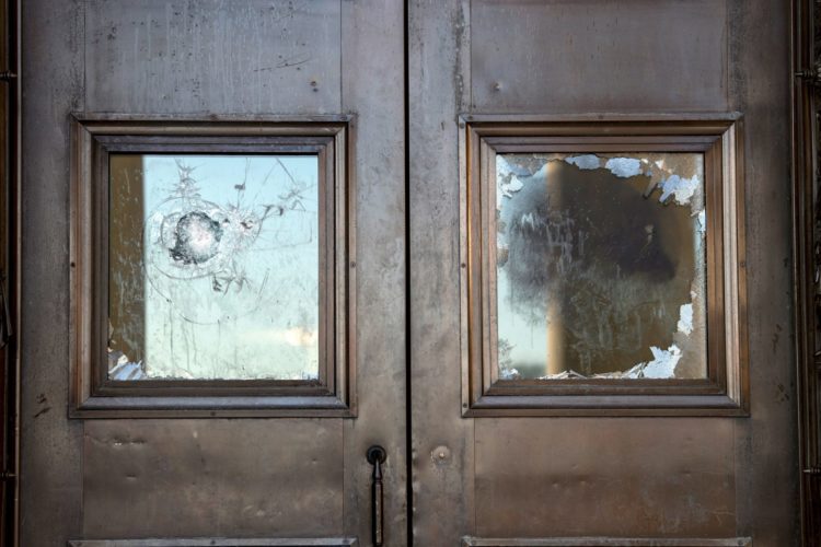 Broken windows on doors at the U.S. Capitol