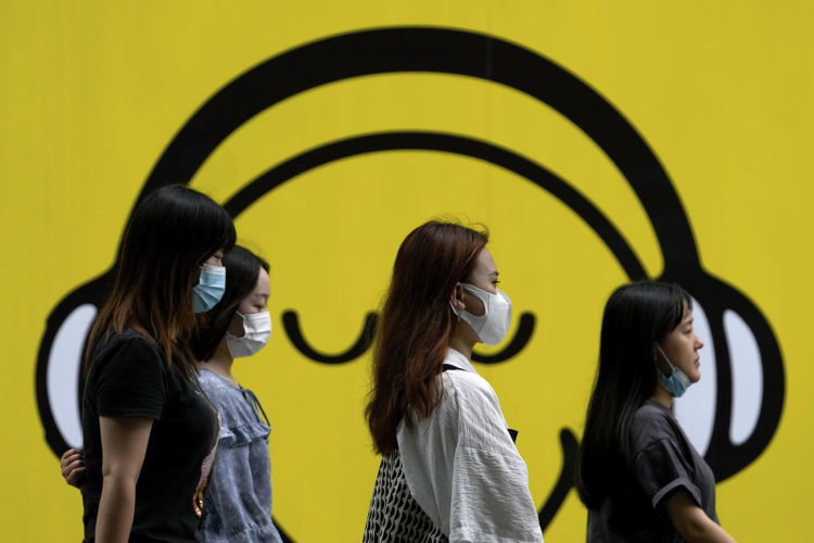 Young women wearing masks in China to protect against COVID