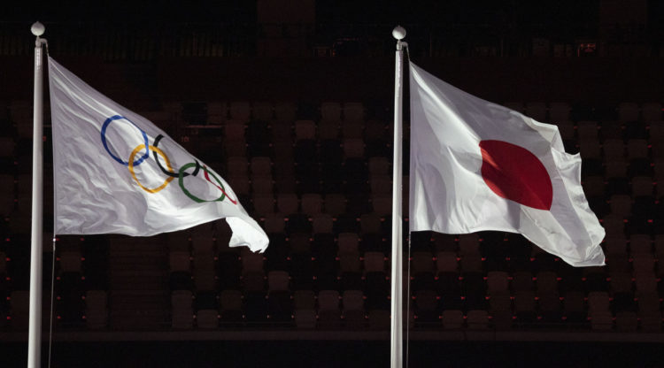 The Olympic flag and Japanese flag at closing ceremony of 2021 Summer Olympics