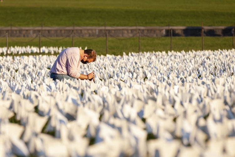 More than 670,000 white flags cover 20 acres at the National Mall in a memorial to Americans who have died of COVID-19 as of mid-September, 2021