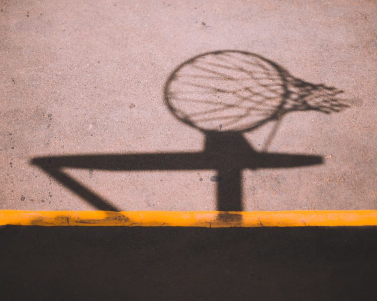 Shadow of a basketball hoop