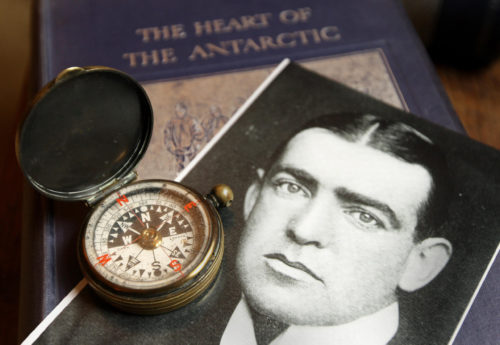 Portrait of Antarctic explorer Sir Ernest Shackleton and his compass
