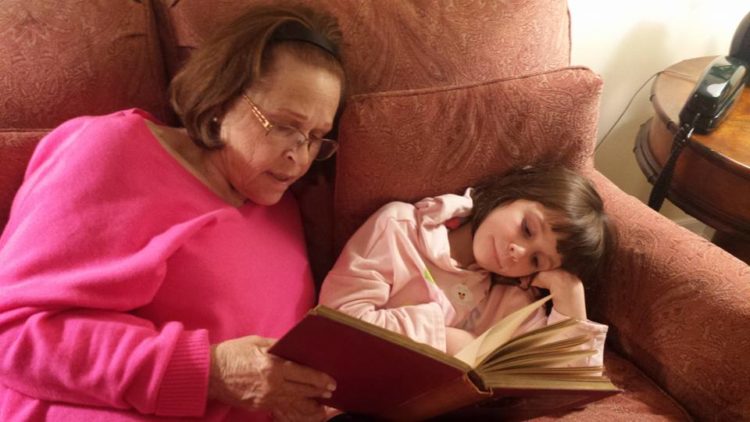 Sylvie Lednicer with her granddaughter, Rachel, reading "The Canterbury Tales"