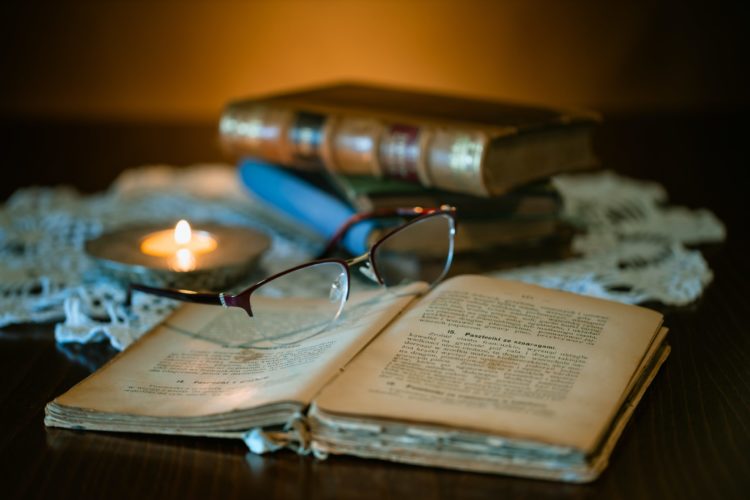 Old book and eyeglasses