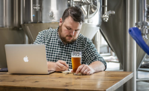 Charlie Scudder judging craft beer in a Dallas area brewery