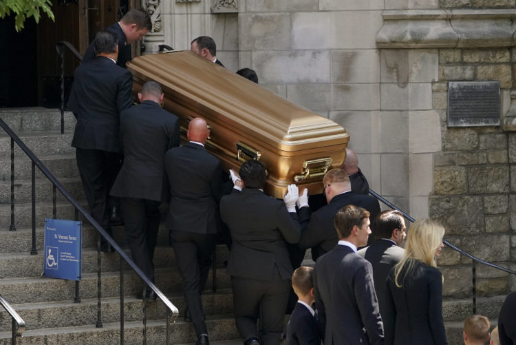 Pallbearers carry Ivana Trump's casket into a church in New York City