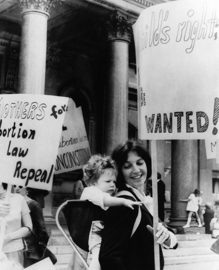 A mother carries her child in a pro-abortion rights demonstration in New Jersey in 1969