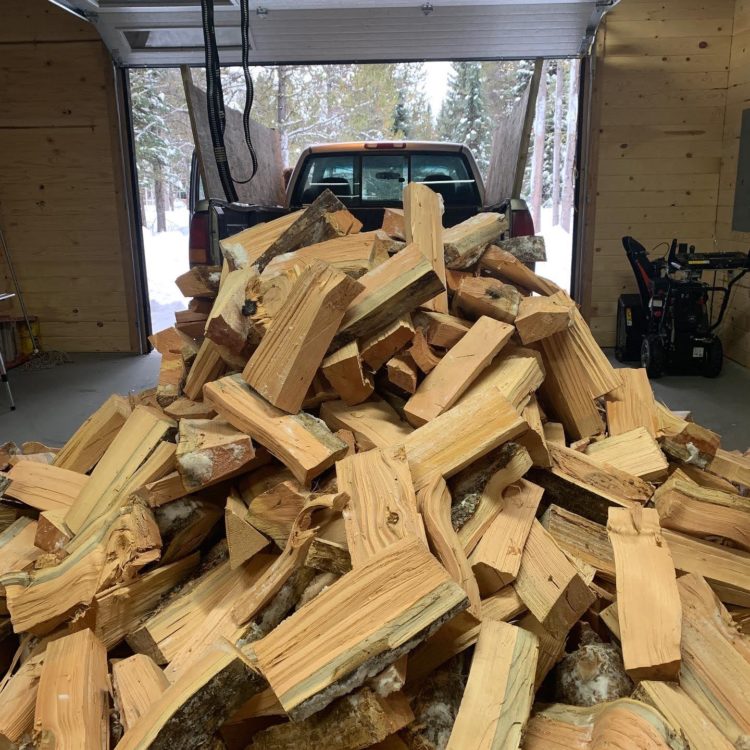 A cord of firewood dumped in a driveway in Idaho