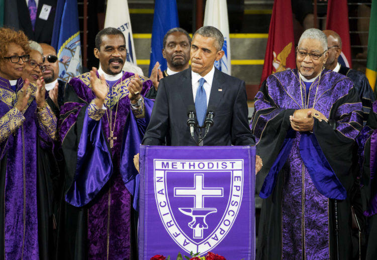 President Barack Obama speaking at a Jservice for victims of a massacre at a June 2015