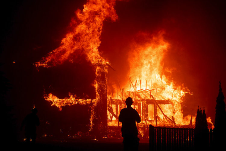 A house burns in the Camp Fire in Paradise, California, on Nov. 8, 2018.