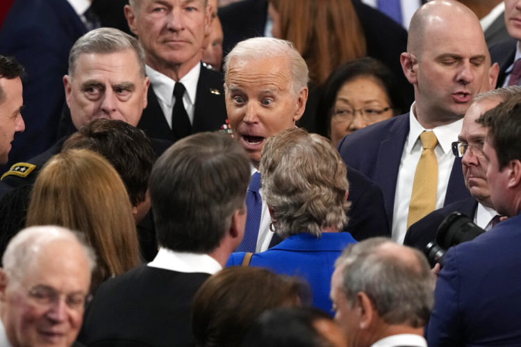 President Joe Biden on the floor of Congress after delivering the 2023 State of the Union address.