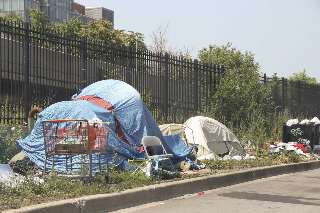 A homeless encampment along a street near Chicago's downtown in summer, 2022.
