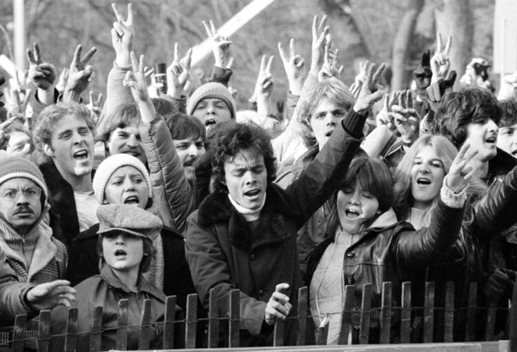 Photo of John Lennon fans gathered in New York's Central Park on Dec. 14, 1980, after Lennon was shot and killed.