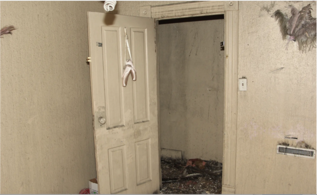 Photo of a child's ballet slippers on an internal door of a house in West Allis, Wisconsin, where three children were killed in a fire in April 2013.