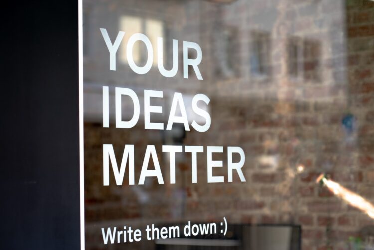 Window with words saying: YOUR IDEAS MATTER (Write them down)