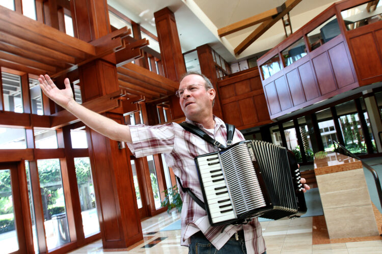 Poynter writing coach and author Roy Peter Clark playing the accordion