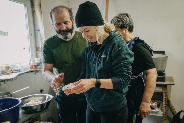 Washington Post reporter Lizzie Johnson making Christmas dinner with Ukrainian soldiers at a military outpost.