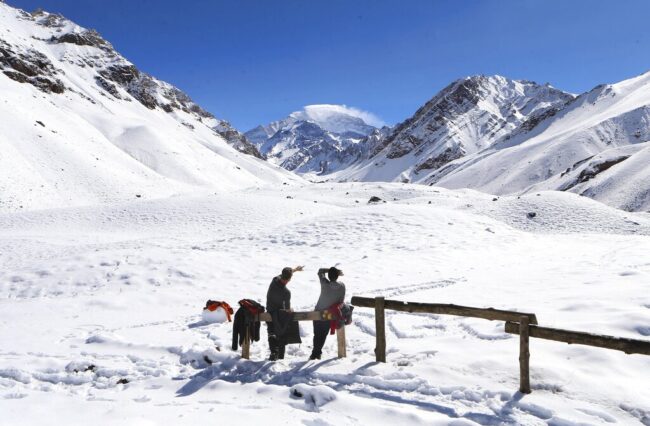 Tourists looking at Aconcagua mountain in Argentina, the highest mountain in the Western Hemisphere.