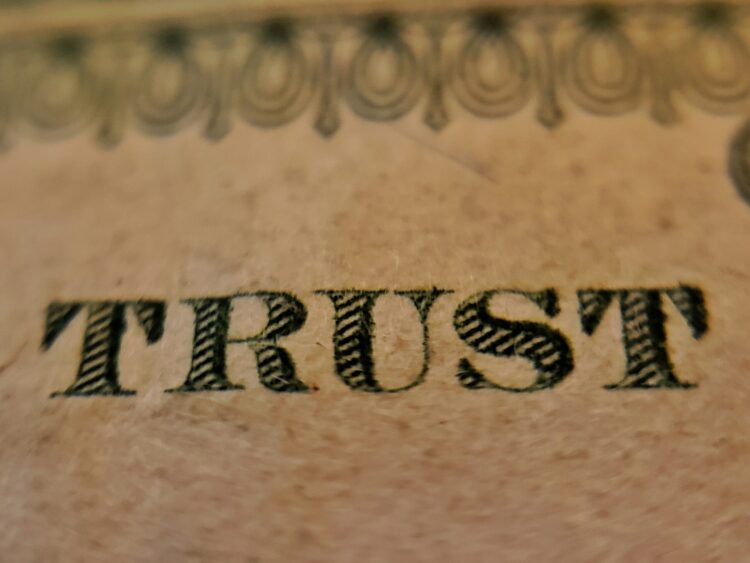 A mat or tattoo that says TRUST