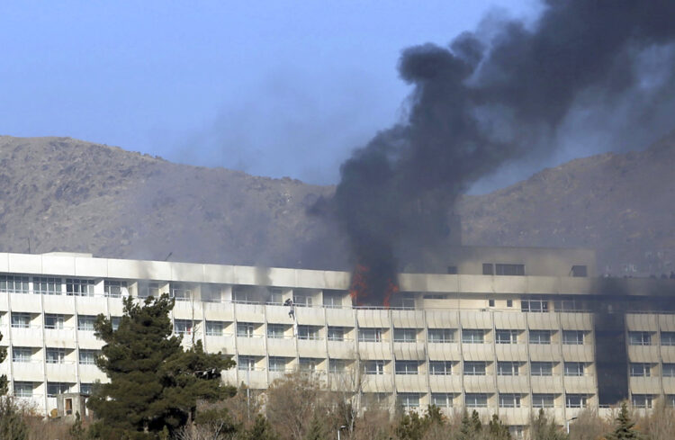 Smoke and fire billows from the top floor of the Intercontinental Hotel in Kabul, Afghanistan, during an assault by gunmen in Jan. 21, 2018.