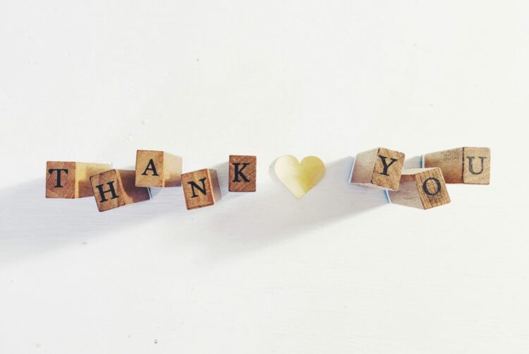 Wooden stamping blocks that spell out THANK YOU